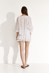 White Shorts With Fine Pleats And Lace-Trimmed Hems
