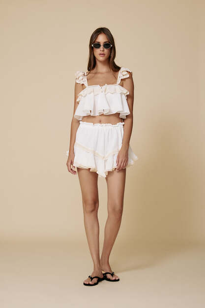 Cropped top with delicate ruffles and lace straps